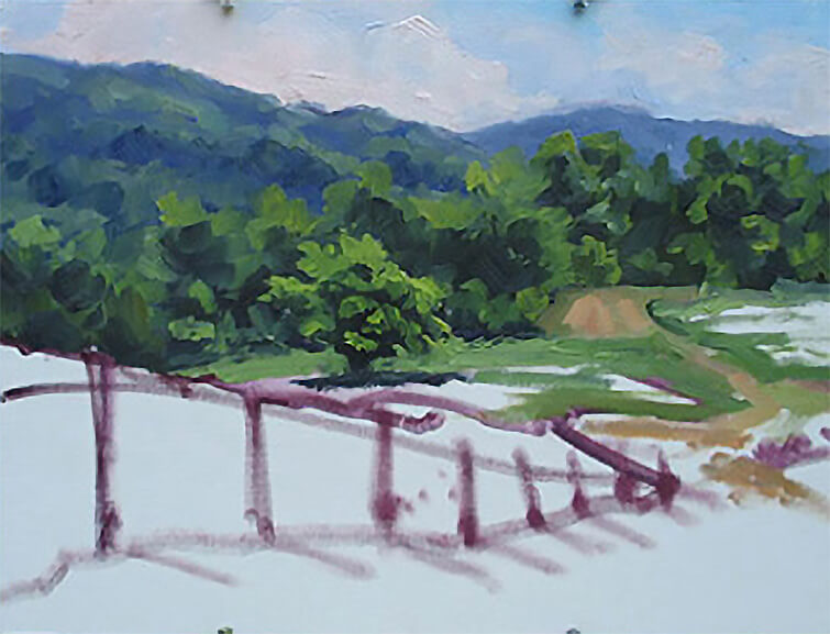 Painted road and field in the middle ground